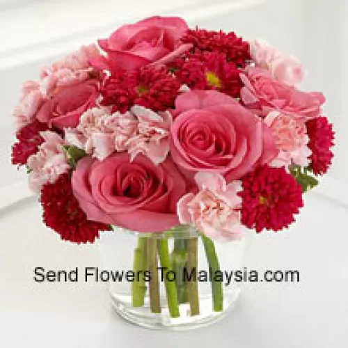 6 Pink Roses, 10 Red Colored Daisies And 10 Pink Colored Carnations In A Glass Vase