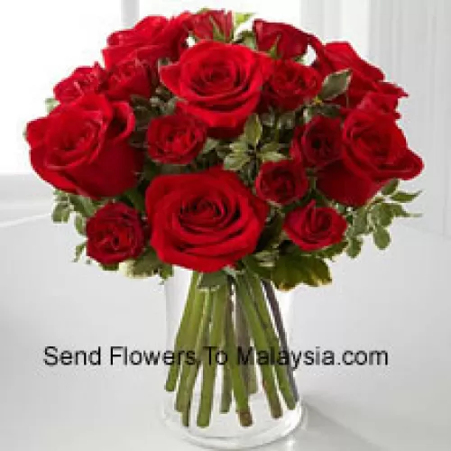 18 Red Colored Roses In A Glass Vase